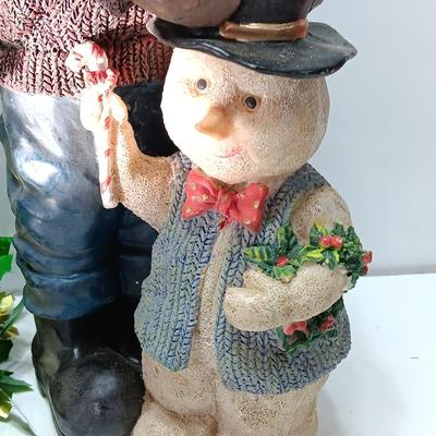 Large Santa building a snowman with plastic tinsel tree