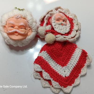 Two vintage rubber Santa face collectibles - ornament and crocheted hot pads