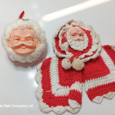 Two vintage rubber Santa face collectibles - ornament and crocheted hot pads