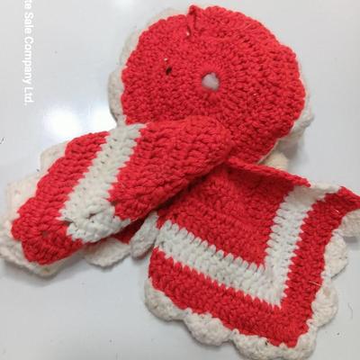 Two vintage rubber Santa face collectibles - ornament and crocheted hot pads