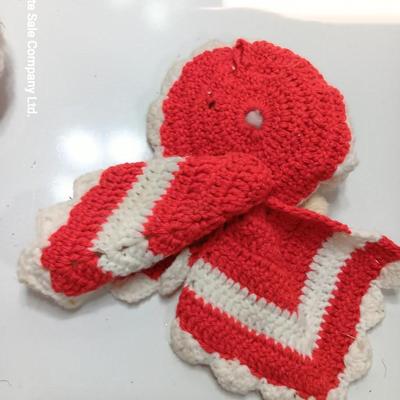 Two vintage rubber Santa face collectibles - ornament and crocheted hot pads