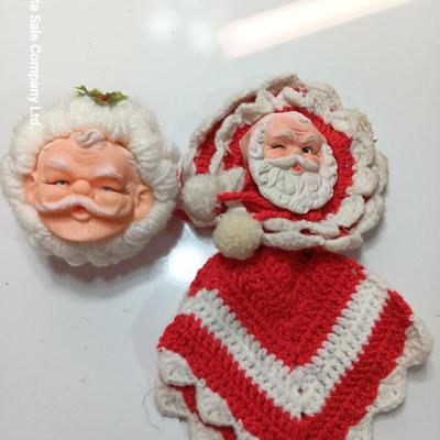 Two vintage rubber Santa face collectibles - ornament and crocheted hot pads