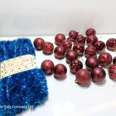 Maroon plastic ornaments with blue garland