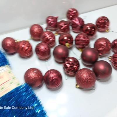 Maroon plastic ornaments with blue garland