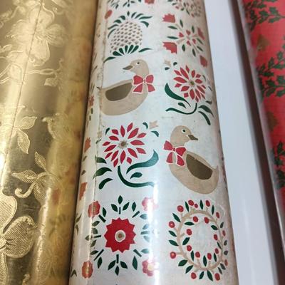 Three large rolls and one smaller roll of Vintage wrapping paper