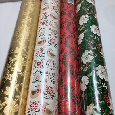 Three large rolls and one smaller roll of Vintage wrapping paper