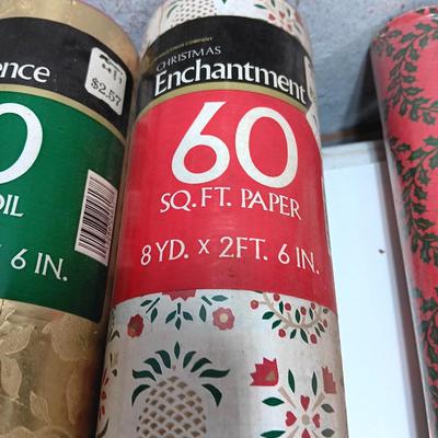 Three large rolls and one smaller roll of Vintage wrapping paper