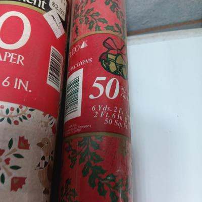 Three large rolls and one smaller roll of Vintage wrapping paper
