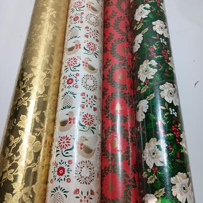 Three large rolls and one smaller roll of Vintage wrapping paper