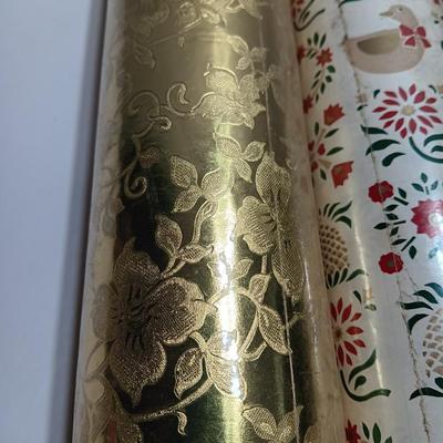 Three large rolls and one smaller roll of Vintage wrapping paper