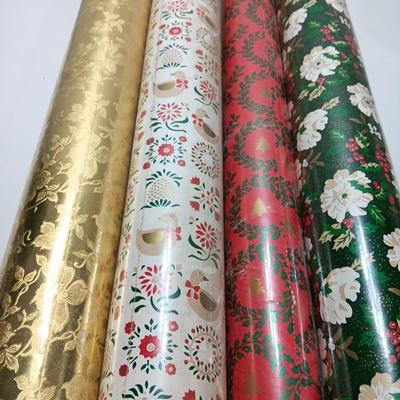 Three large rolls and one smaller roll of Vintage wrapping paper