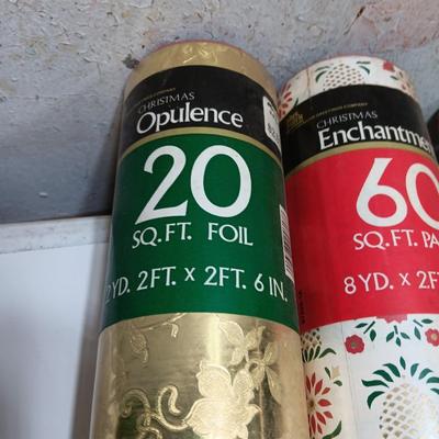 Three large rolls and one smaller roll of Vintage wrapping paper