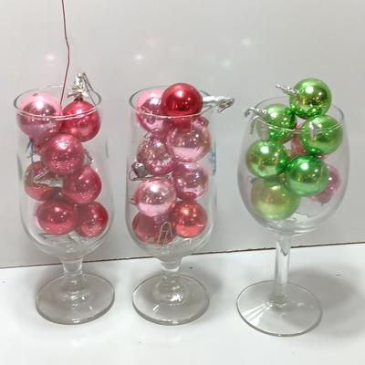 Three wine glasses with vintage glass ornaments