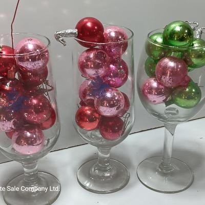 Three wine glasses with vintage glass ornaments