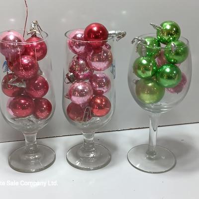 Three wine glasses with vintage glass ornaments