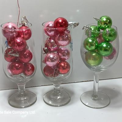 Three wine glasses with vintage glass ornaments