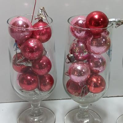 Three wine glasses with vintage glass ornaments