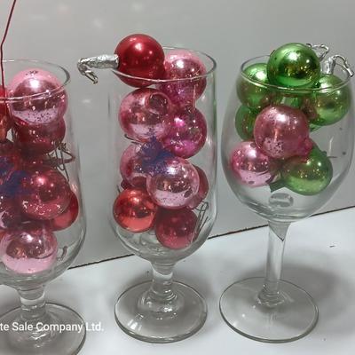Three wine glasses with vintage glass ornaments