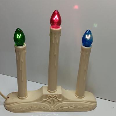 Collection of three tea pots and a working candelabra Christmas candle