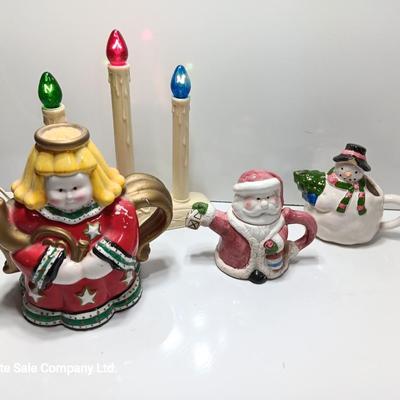 Collection of three tea pots and a working candelabra Christmas candle
