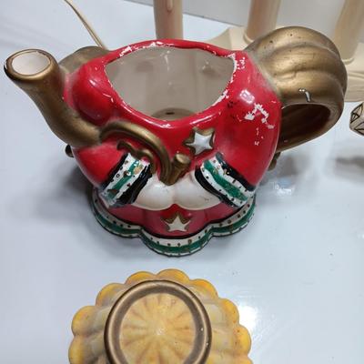 Collection of three tea pots and a working candelabra Christmas candle