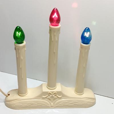 Collection of three tea pots and a working candelabra Christmas candle