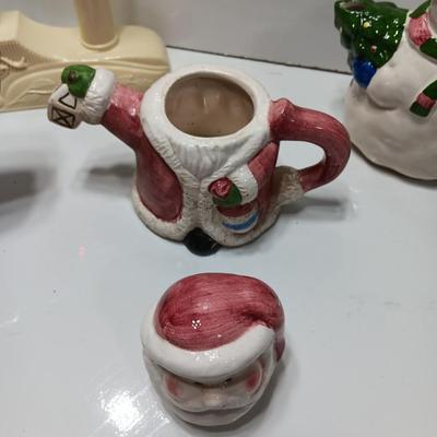 Collection of three tea pots and a working candelabra Christmas candle