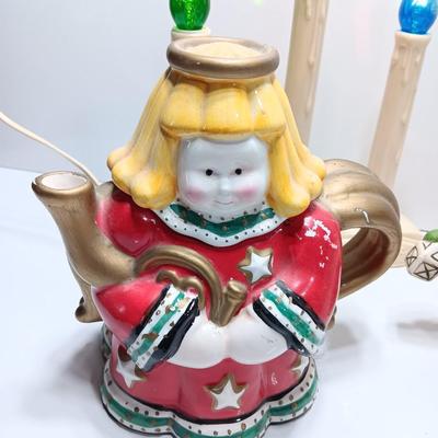 Collection of three tea pots and a working candelabra Christmas candle