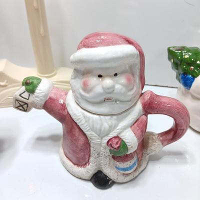 Collection of three tea pots and a working candelabra Christmas candle