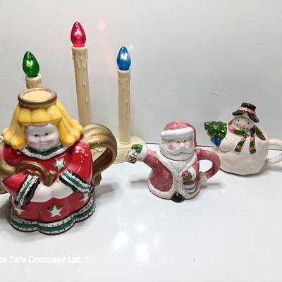 Collection of three tea pots and a working candelabra Christmas candle