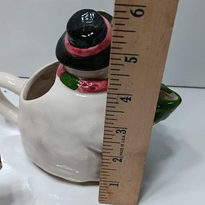Collection of three tea pots and a working candelabra Christmas candle