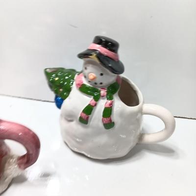 Collection of three tea pots and a working candelabra Christmas candle