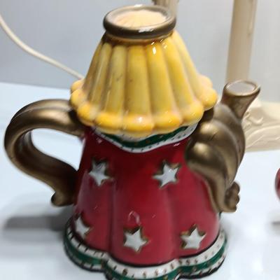 Collection of three tea pots and a working candelabra Christmas candle