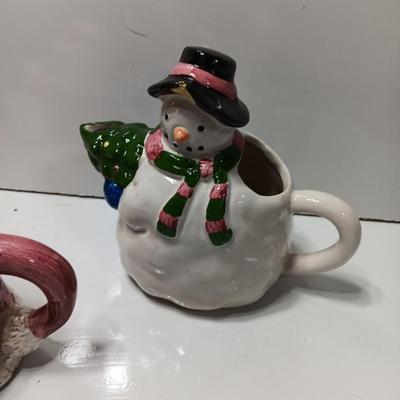 Collection of three tea pots and a working candelabra Christmas candle