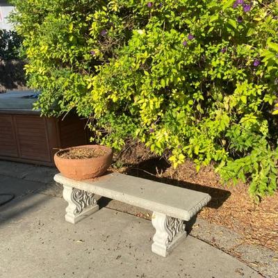 Garden decor, cement benches and lots of pots 