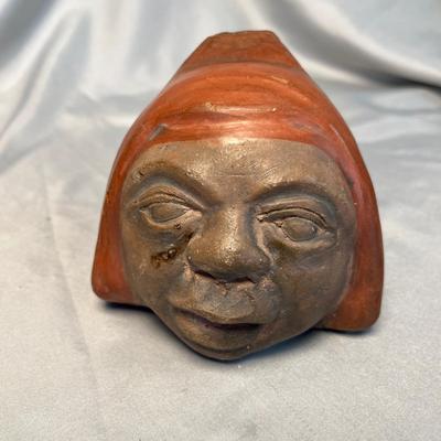 Pottery face sculpture