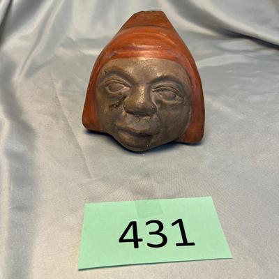 Pottery face sculpture