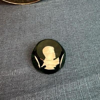Lot No. 73, JFK metal Reed and Barton collectible plate 11 inches across and JFK paperweight