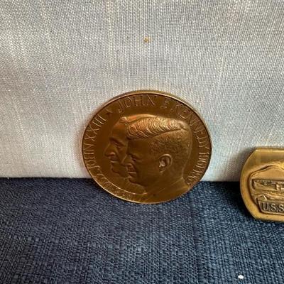 Lot 76, USS, John F Kennedy belt buckle + 2 paperweight coins
