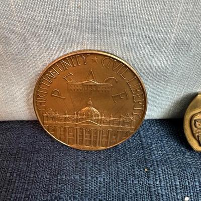 Lot 76, USS, John F Kennedy belt buckle + 2 paperweight coins