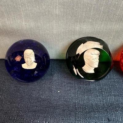 Lot 81 Kennedy paperweights, three glass, one acrylic