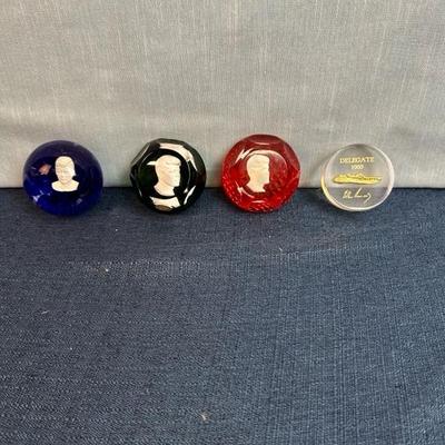 Lot 81 Kennedy paperweights, three glass, one acrylic