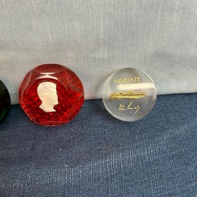 Lot 81 Kennedy paperweights, three glass, one acrylic