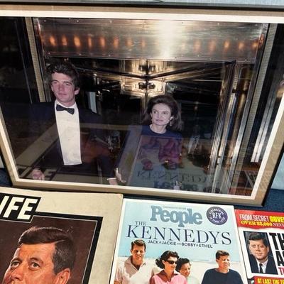 Lot 108  Framed photograph of John F Kennedy Jr. and Jacqueline Kennedy. Also several magazines.