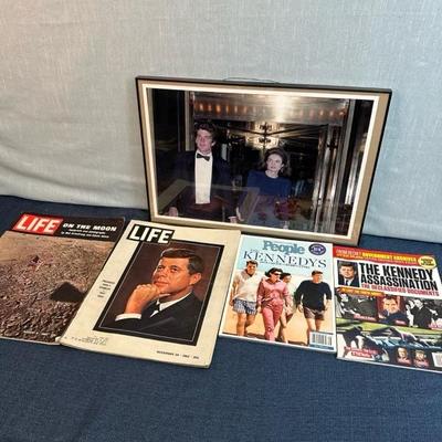 Lot 108  Framed photograph of John F Kennedy Jr. and Jacqueline Kennedy. Also several magazines.