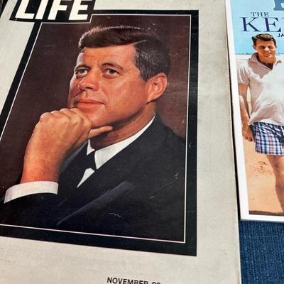 Lot 108  Framed photograph of John F Kennedy Jr. and Jacqueline Kennedy. Also several magazines.