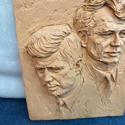 Lot 115 Relief cast panel sculpture of the images of John F. Kennedy and Robert F. Kennedy, done by artist Joseph Zutz