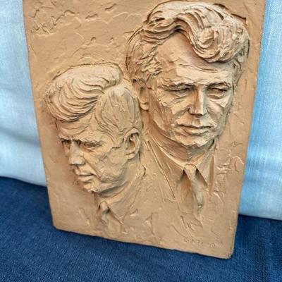 Lot 115 Relief cast panel sculpture of the images of John F. Kennedy and Robert F. Kennedy, done by artist Joseph Zutz