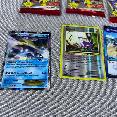 PokÃ©mon Card Packages and some Loose Cards