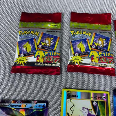 PokÃ©mon Card Packages and some Loose Cards